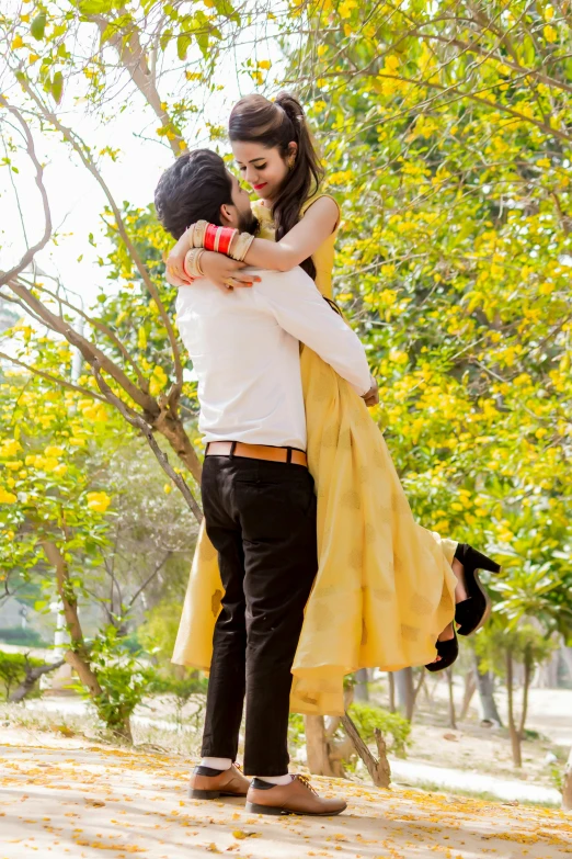 a young woman emcing the man in a yellow dress