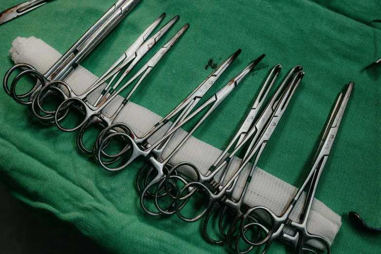 an assortment of scissors and some other metal instruments