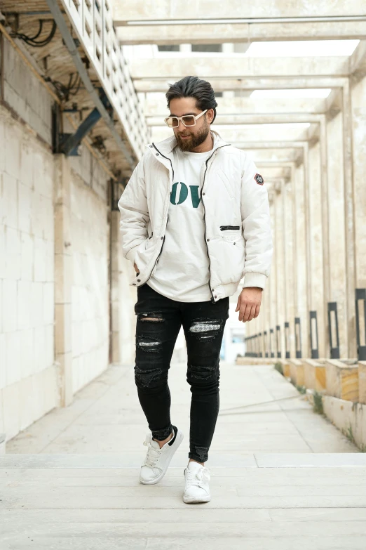 man standing in an tunnel with sunglasses on