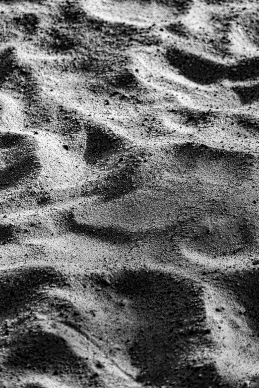 an image of sand in the middle of the ocean