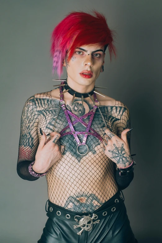 a person with piercings, eye makeup and piercing rings