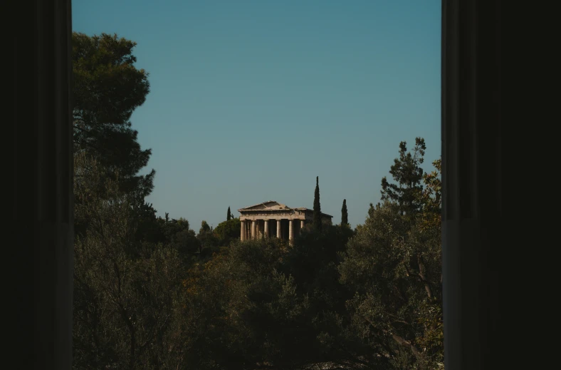 a building in the middle of some trees