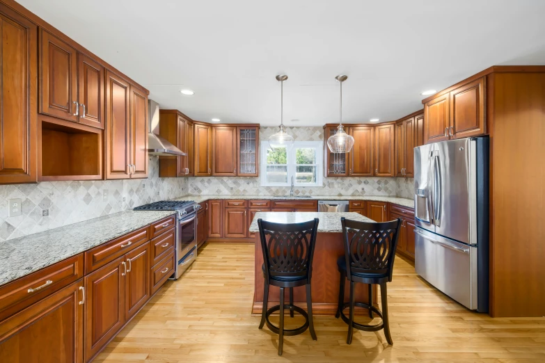 a kitchen with an island surrounded by cabinets