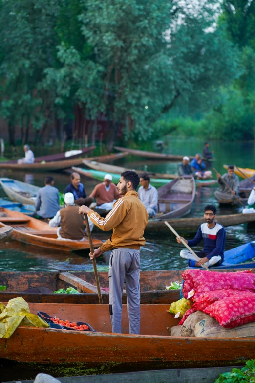 many boats and people floating on a river