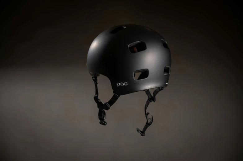 a helmet is sitting on a gray wall