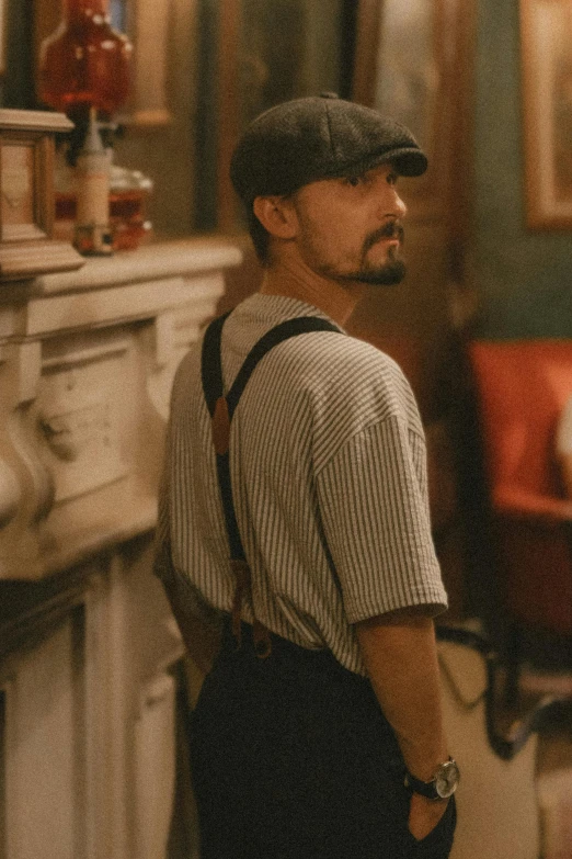 man standing in his living room looking into the closet