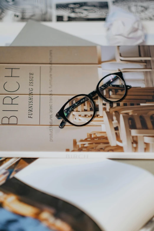a book with some reading glasses on it