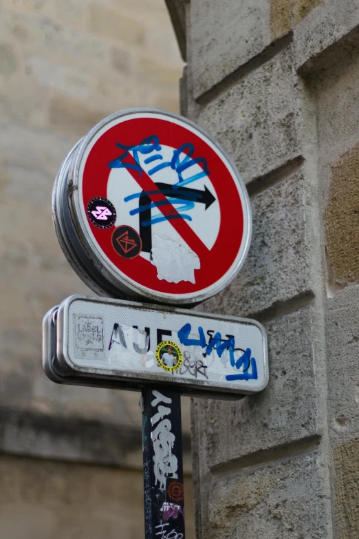 an upside down sign that has graffiti painted on it