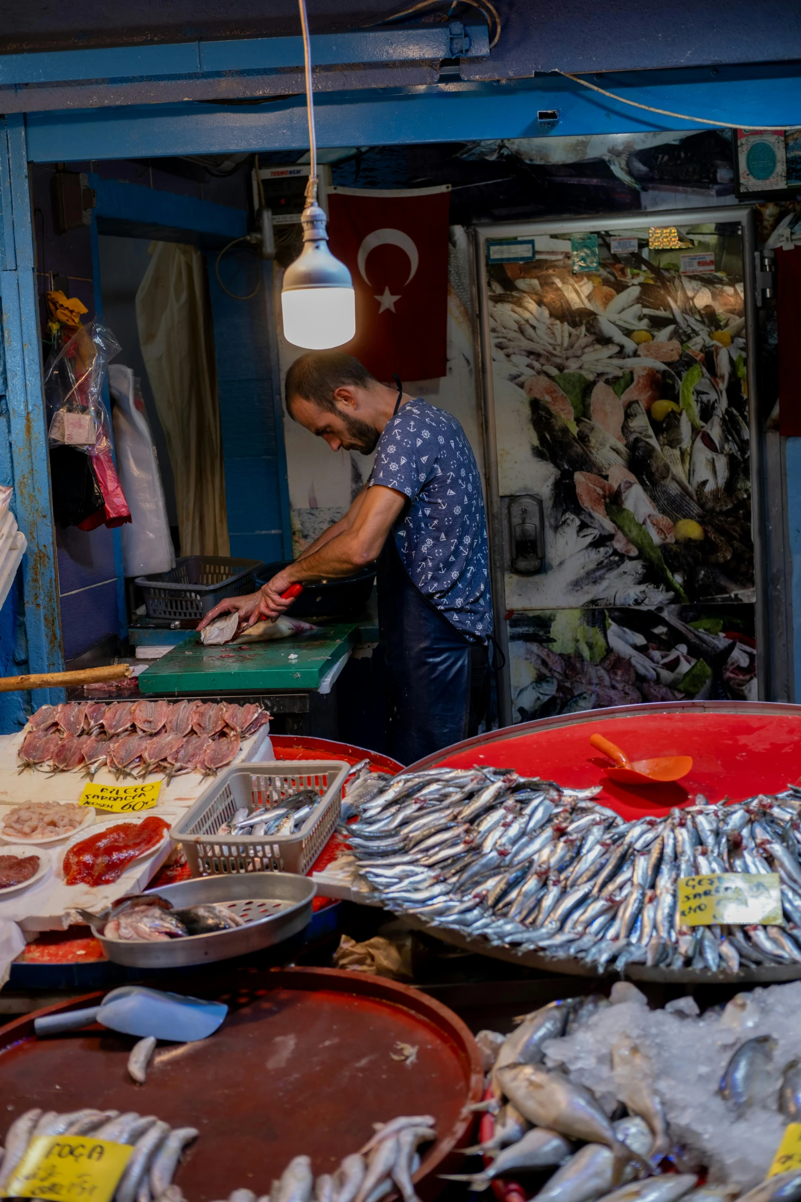 a man preparing a buffet of seafood with a fork