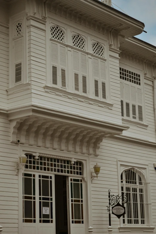 an old wooden building with many windows and balconies