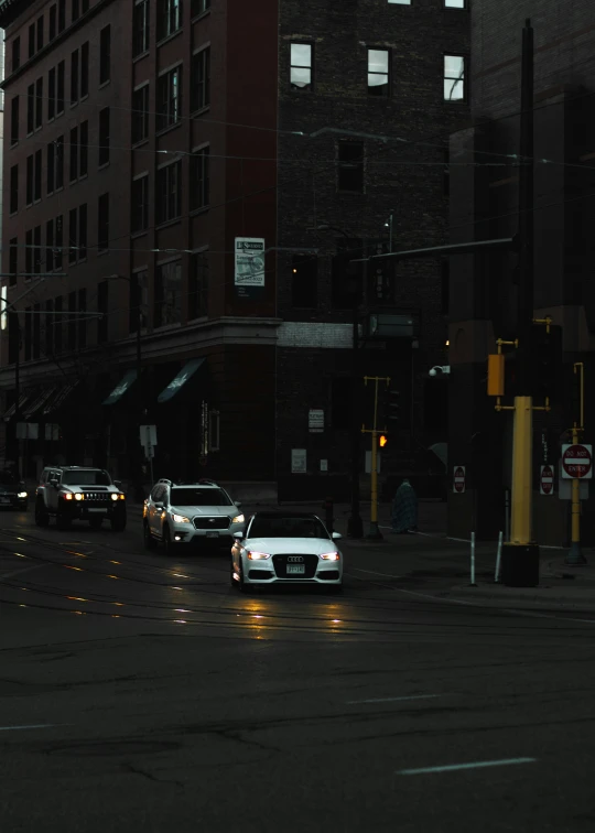 a row of cars are parked in an intersection