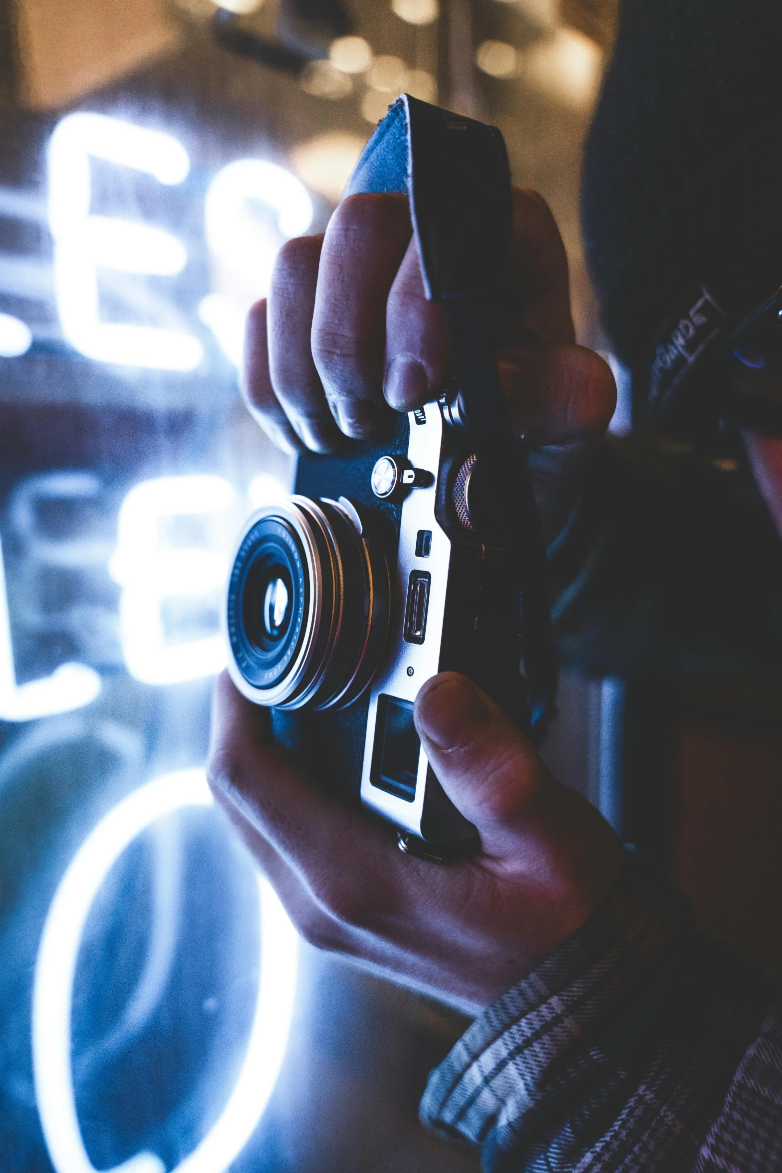 someone holding a camera in their hands to take a picture