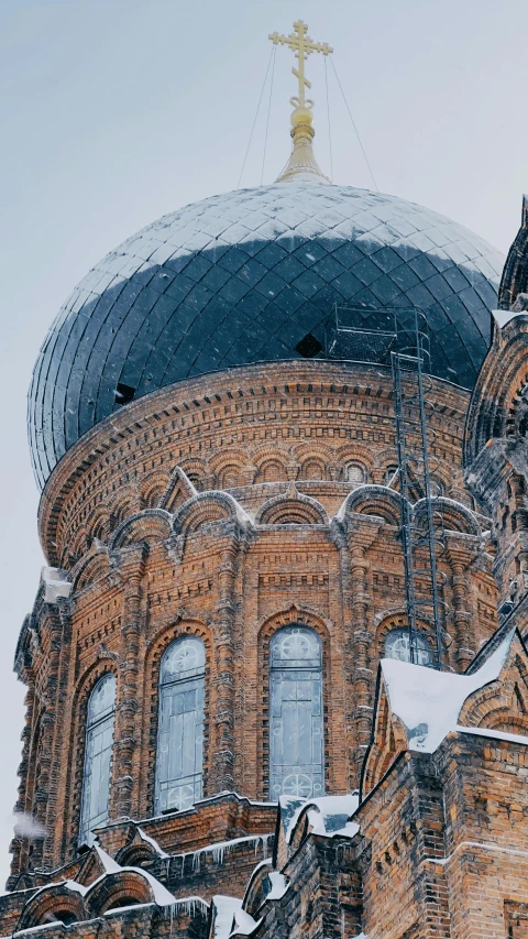 a cathedral spire with a snow covered roof