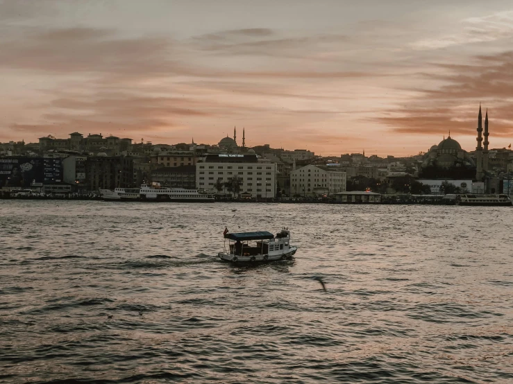 a boat with two passengers is on the water