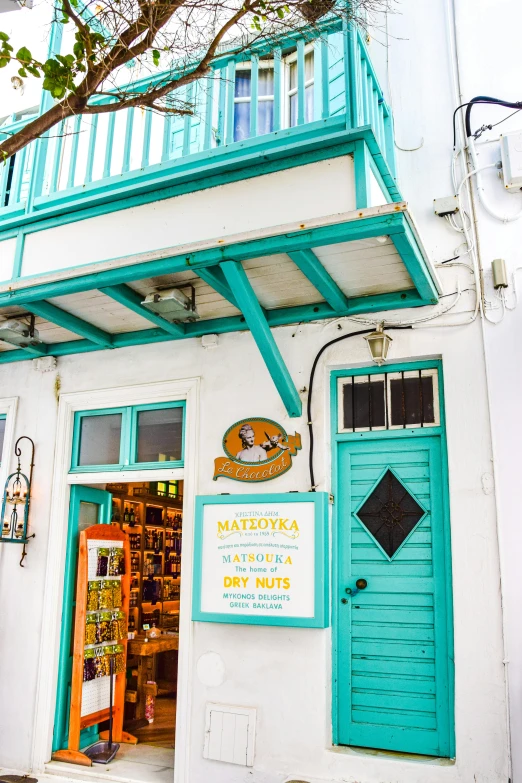 a blue and white store front with an outside view