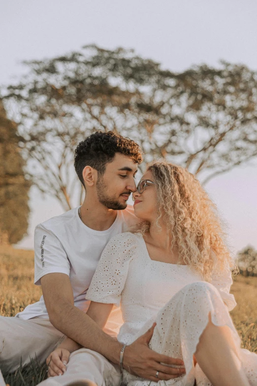 a man and woman that are sitting together