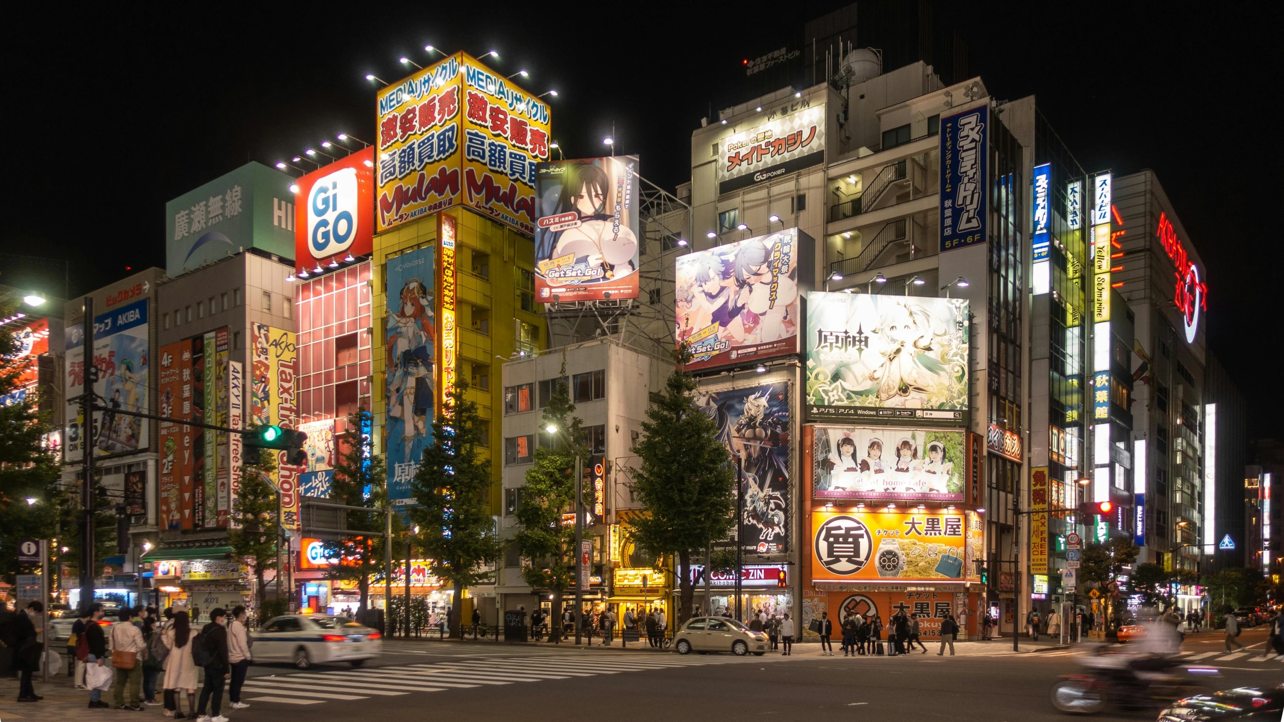 many billboards adorn a large urban area at night