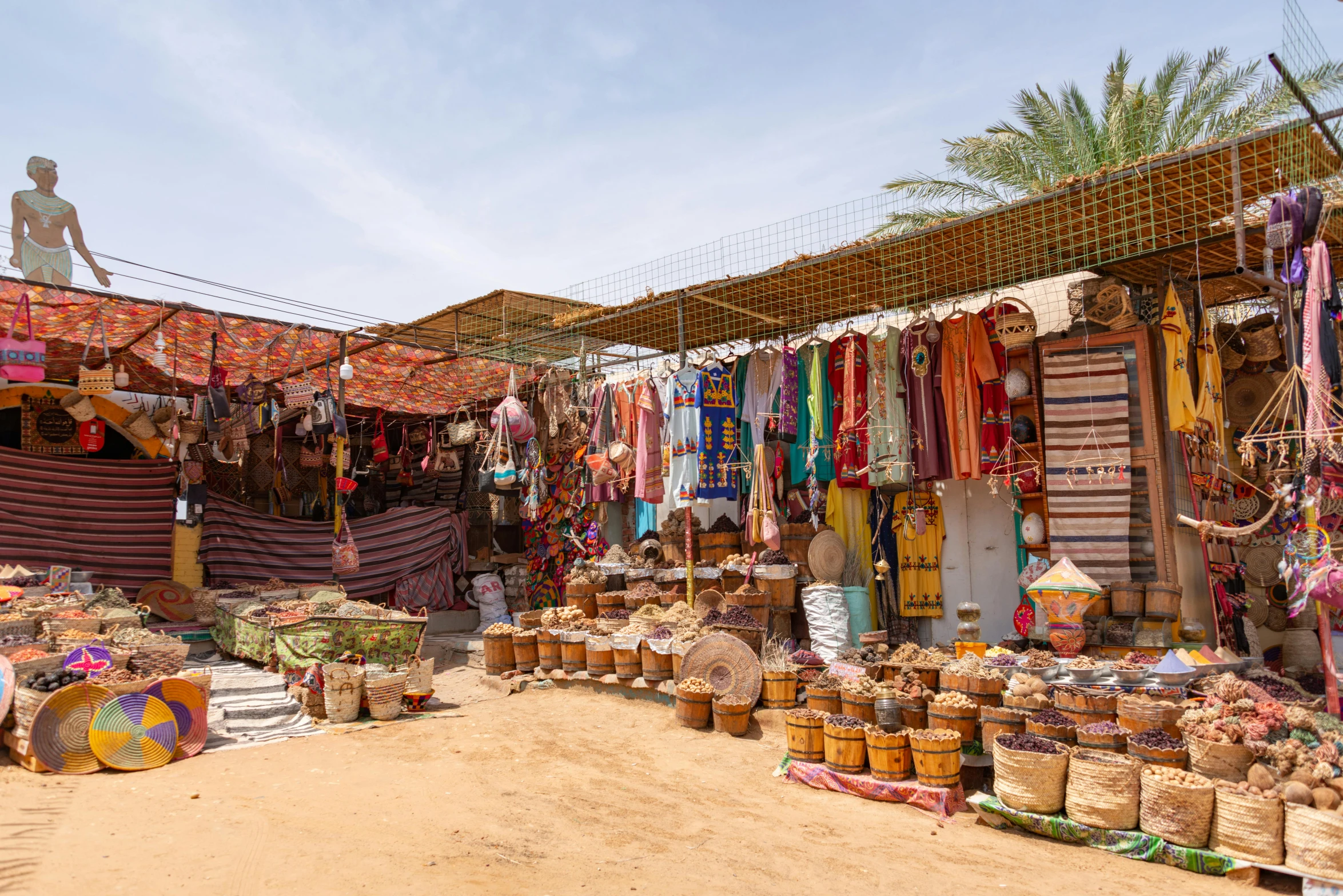 a market with souvenirs, sacks and baskets