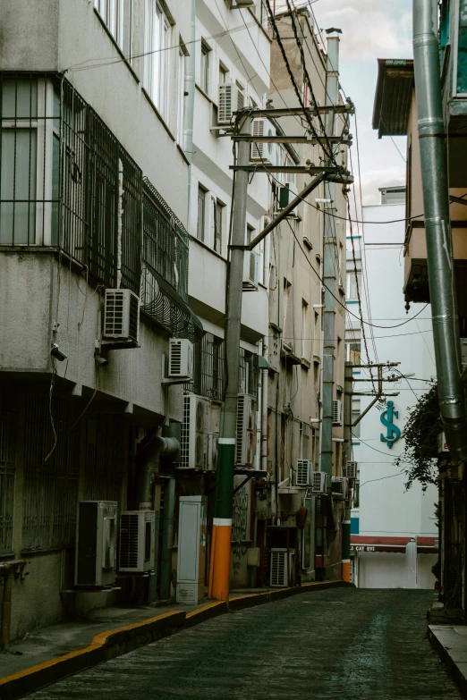 an empty, grey city street has no traffic or pedestrians