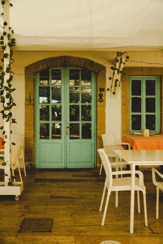 a patio with lots of tables and chairs