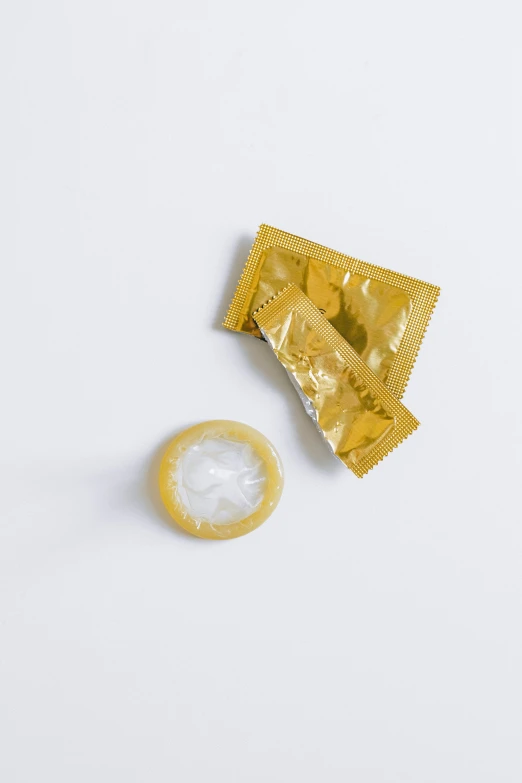 a foil condom and half - eaten condom wrapper