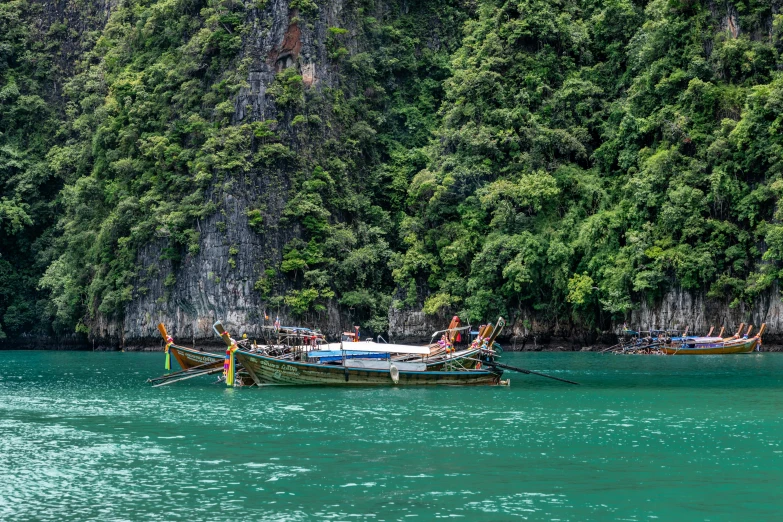 people on a small boat in clear waters