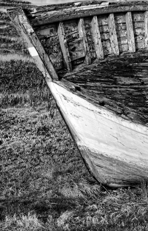 a small boat sitting on top of grass