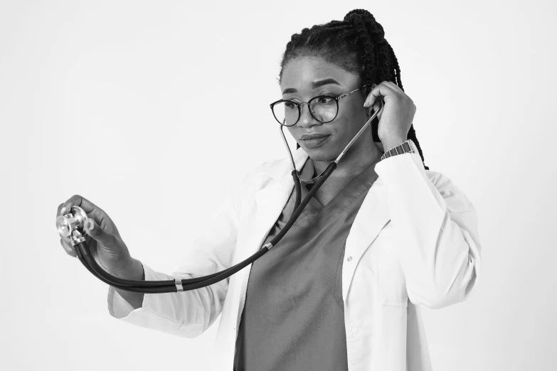 a woman wearing glasses and carrying a stethoscope to her ear