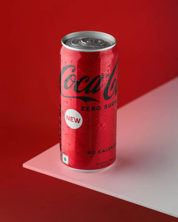 an old coca cola can is shown on a table