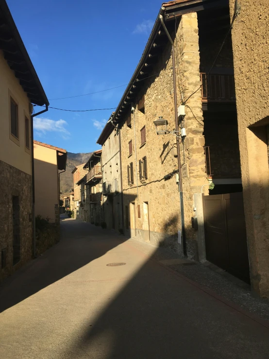 some narrow cobblestone streets with buildings on either side