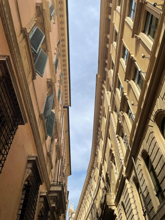 two very tall buildings with clock at the top