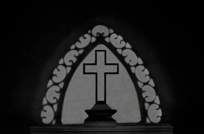 a silhouette of a cross and an arch in a church