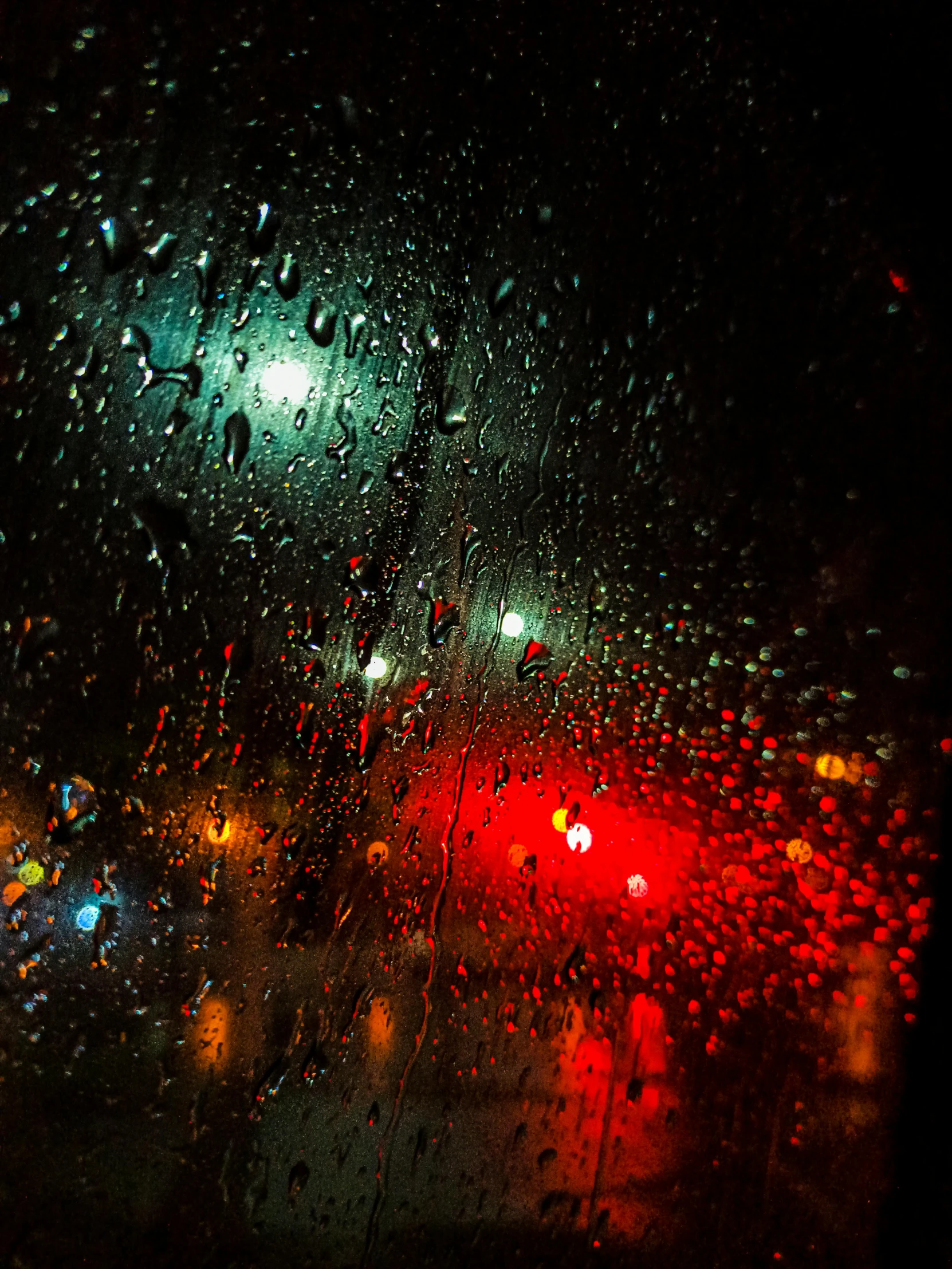 the view through the windshield of an rainy day