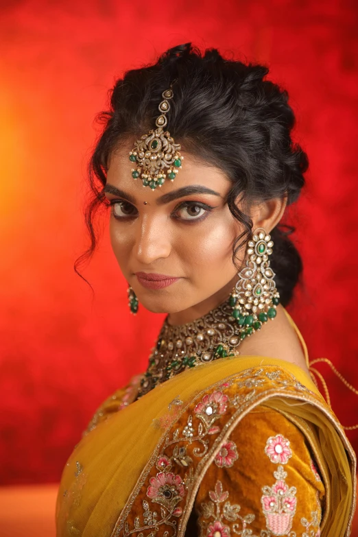 a woman wearing jewelry poses for a po