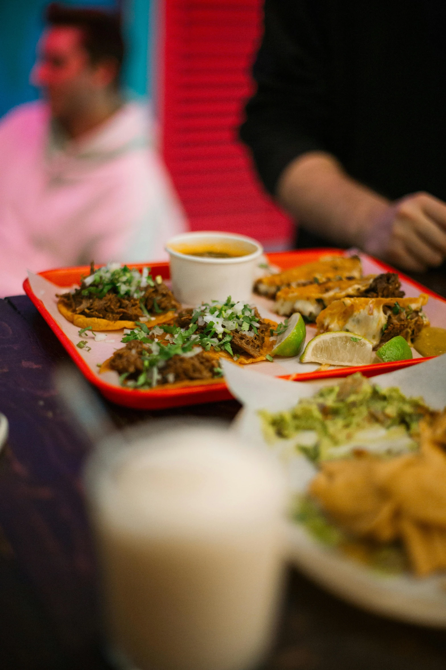 a table topped with plates of food and bowls of soup