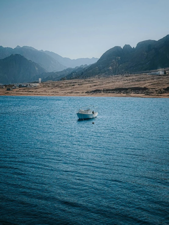 a boat in the middle of a large lake