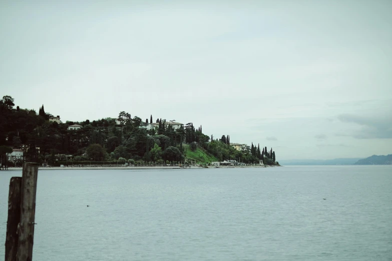 the view is overlooking the water and a mountain with houses