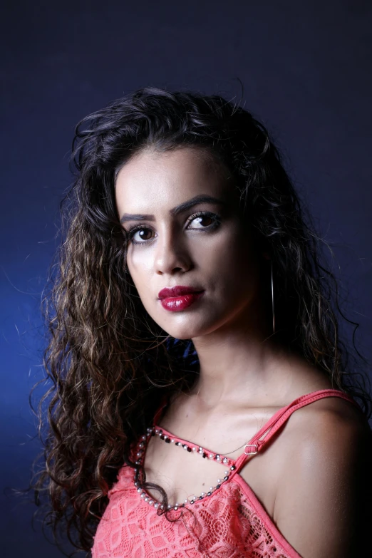 a woman with long hair is posed for a portrait