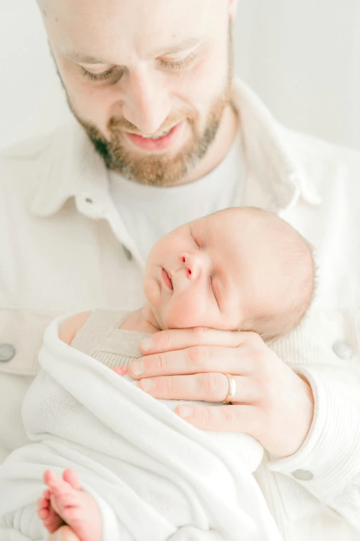 man and baby who are holding each other