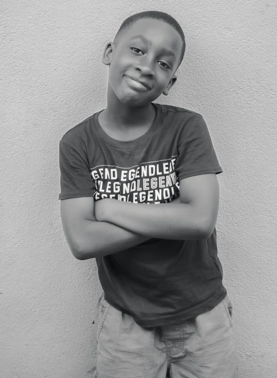 a black and white po of a young person posing for a po
