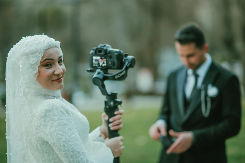 a bride is filmed with her camera