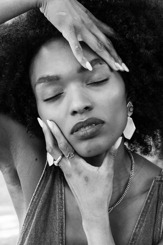 black and white pograph of a woman leaning on her head