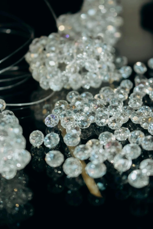 crystal glass beads with long needles on table