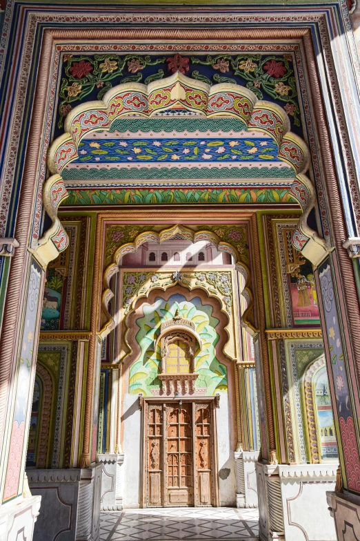 a colorful colored building with two doors and two windows