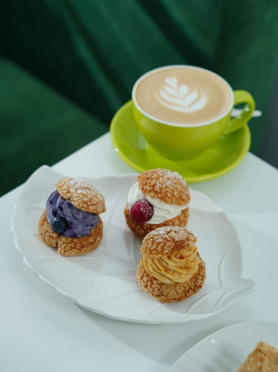 pastry items served with latte art at table