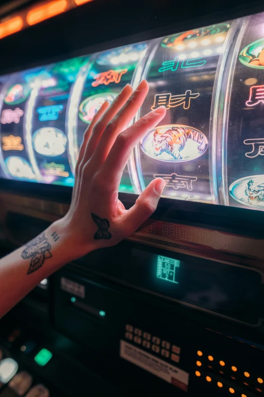 a person playing a slot machine for money