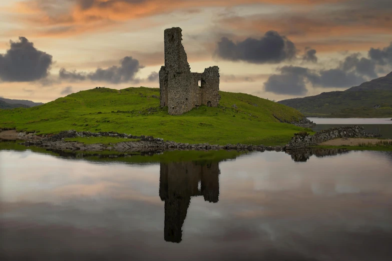 a beautiful castle like structure on an island in the water