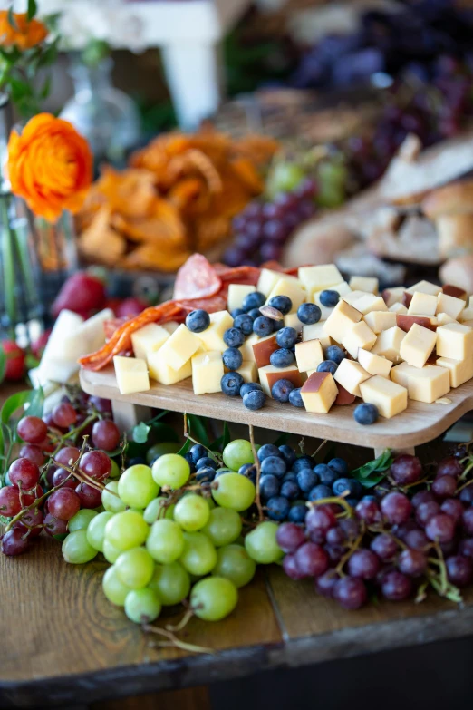 different kinds of cheeses and gs are on the table