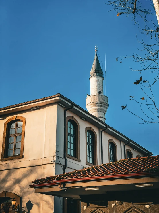 an ornate building with arched doors and a tall steeple