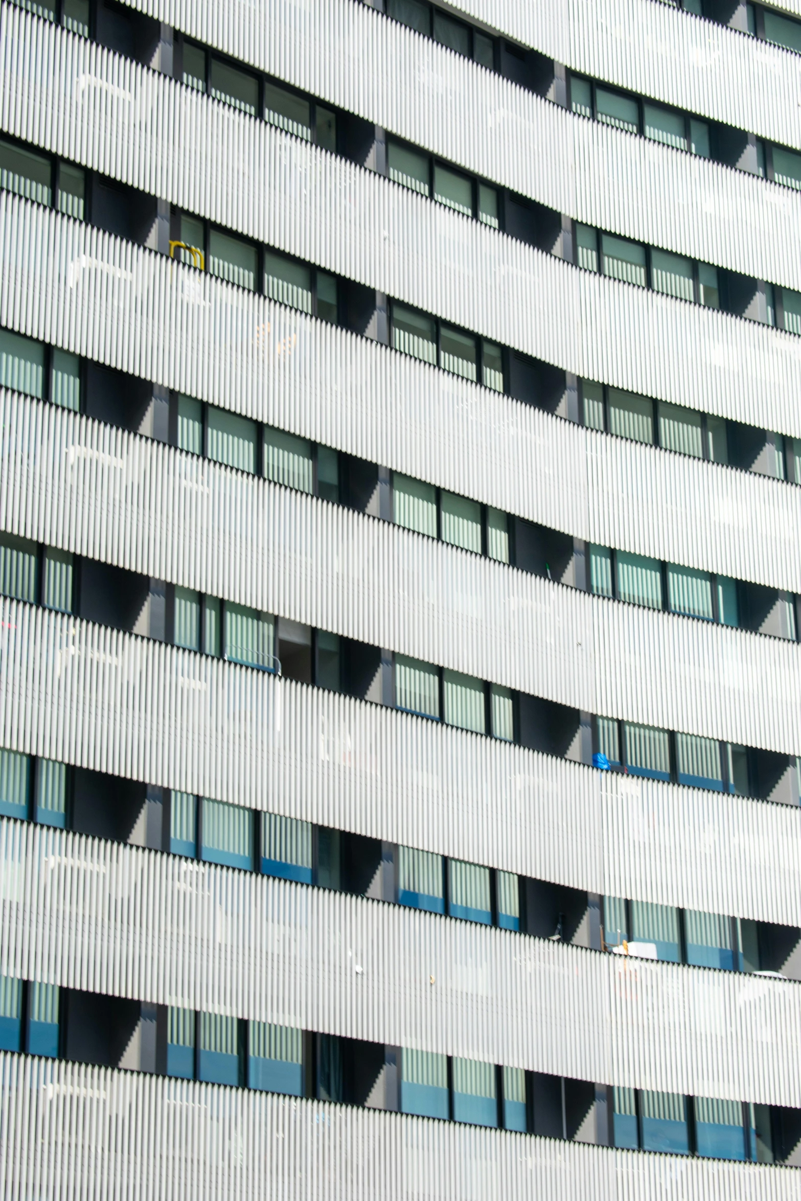 many windows on the side of a building